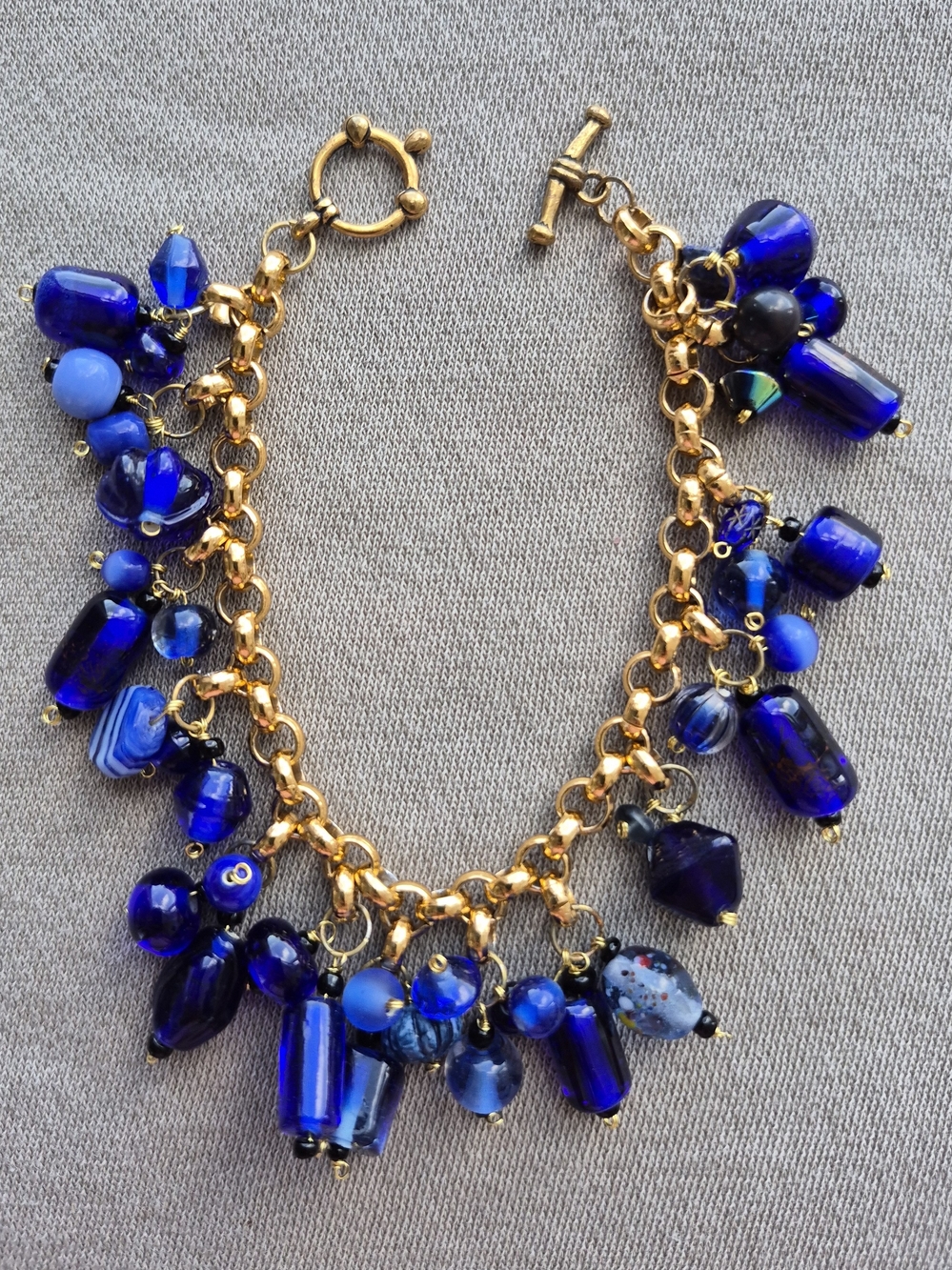 Gold-Tone Charm Bracelet with Deep Blue Glass Beads